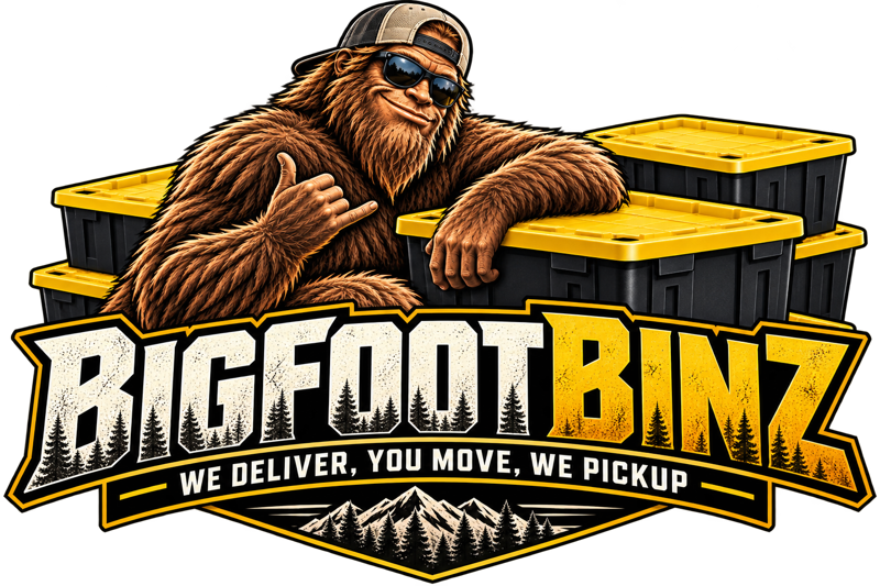 BigFootBinz mascot leaning on black moving totes with yellow lids